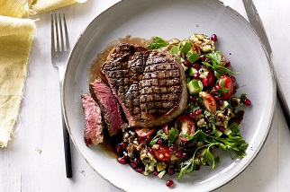 Grilled Aussie beef ribeye steaks with smoky eggplant and pomegranate salad